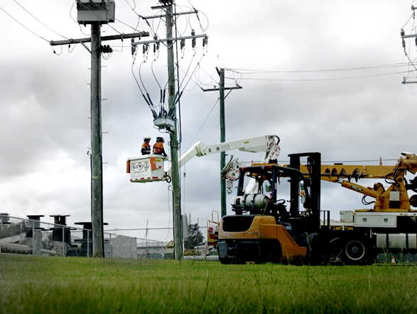 Linemen working on a NOJA Power OSM recloser